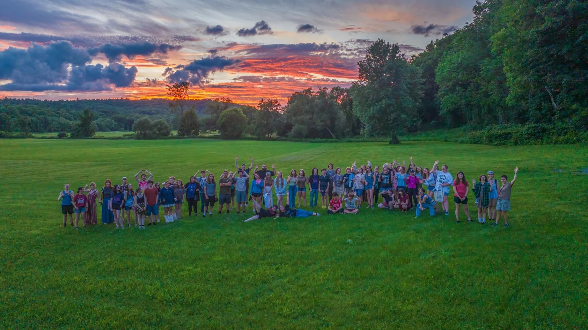Group of students with sunset in the background