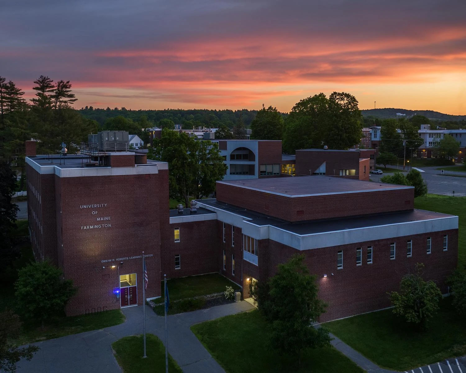 Photo of Roberts Learning Center with sunset int he background.
