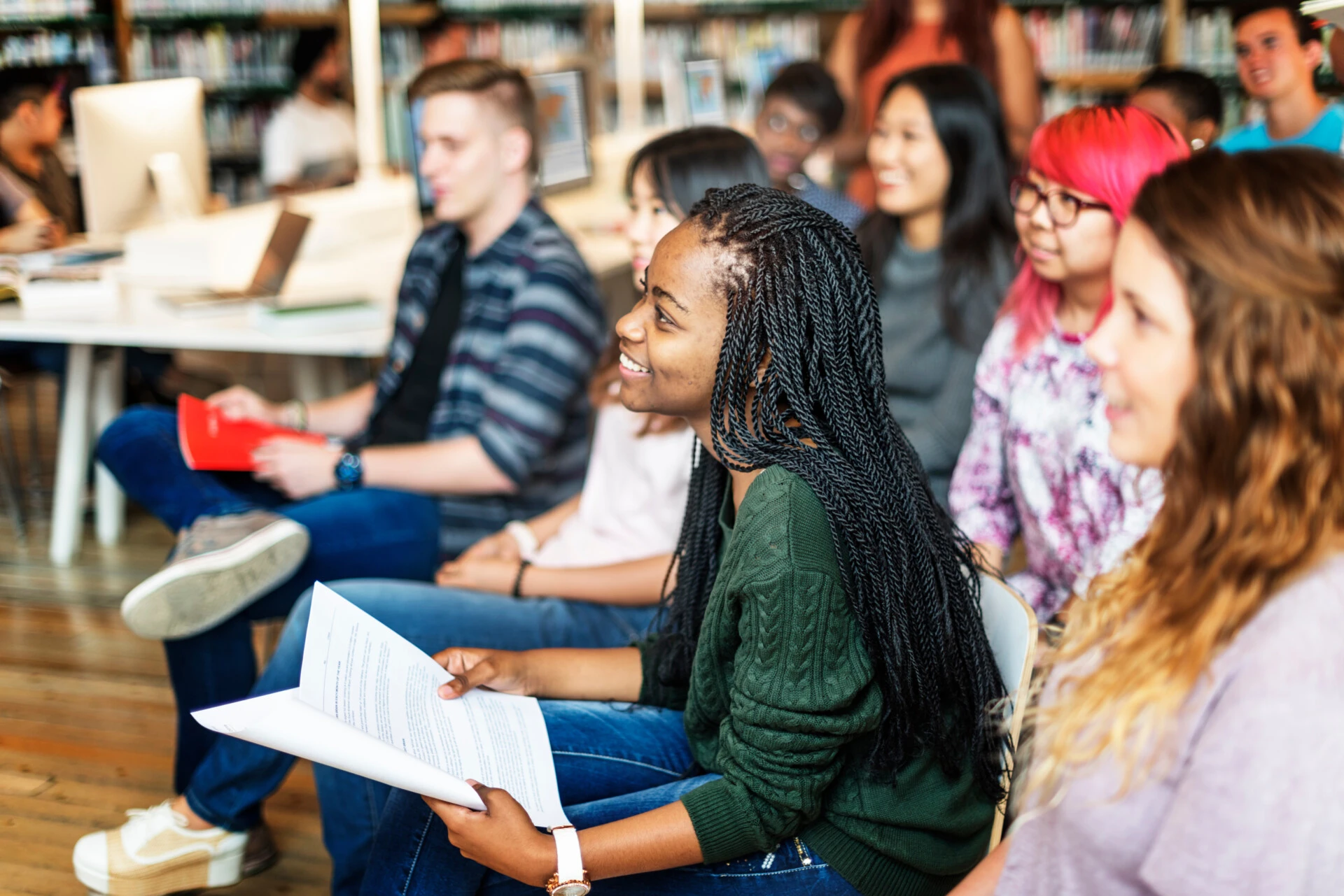 Profile view of students engaged in a classroom setting