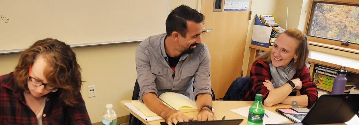 Mathematics Specialists students work together at classroom table.