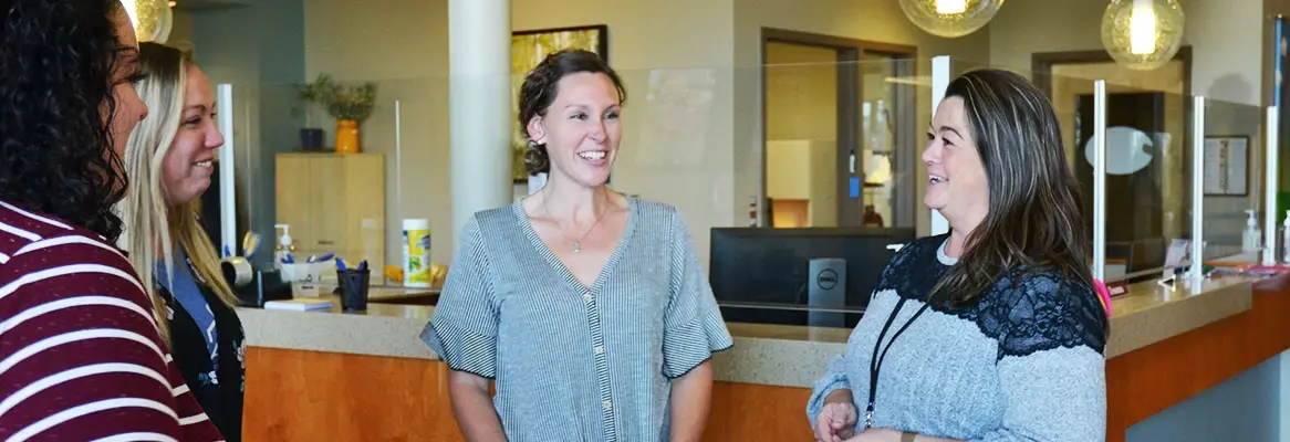 Special Education Administration students stand together speaking.