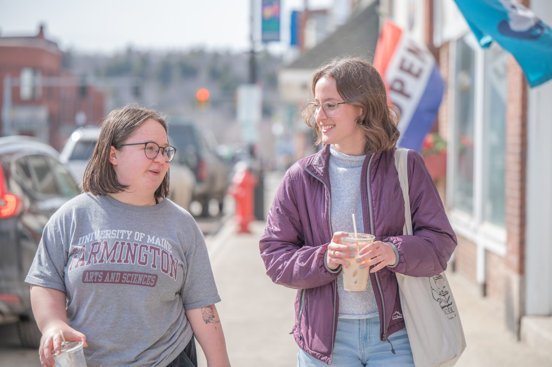 Two students walking downtown in Farmington, Maine.