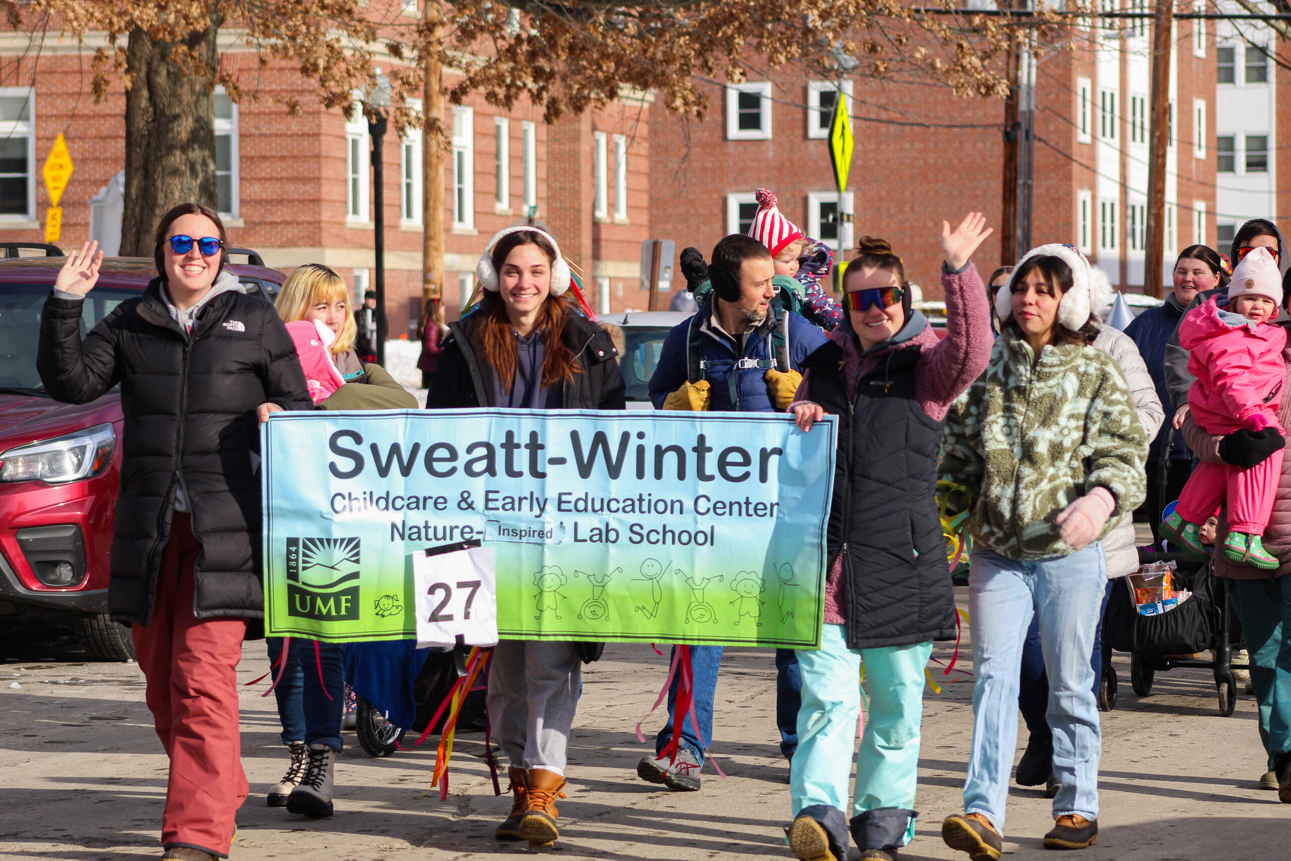 A group of Students happily leading a parade