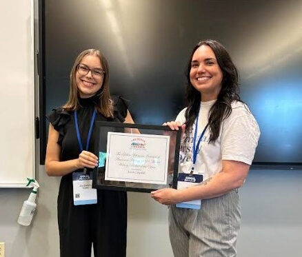 Jacquelyn Taylor (left) presents the Gilder Lehrman Institute’s History Teacher of the Year to Sarah Campbell of Brunswick High School.