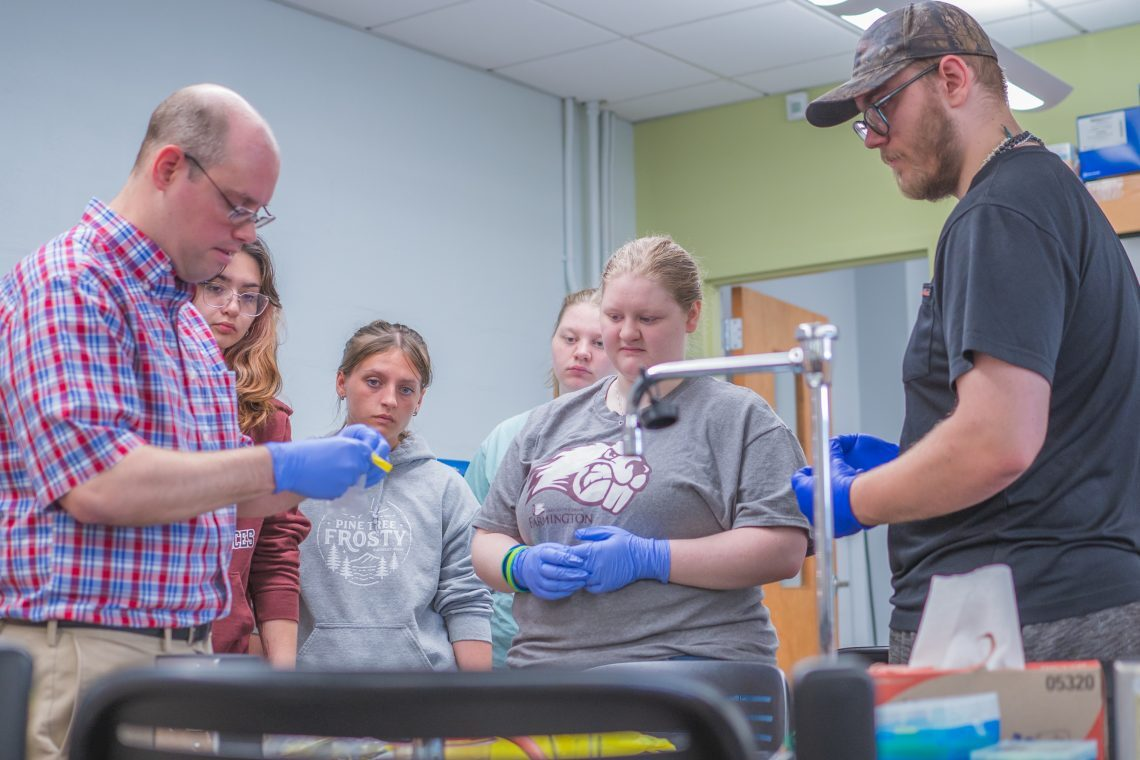 UMF Professor of Biology Tim Breton engages Mt. Blue High School students in National Science Foundation research project.